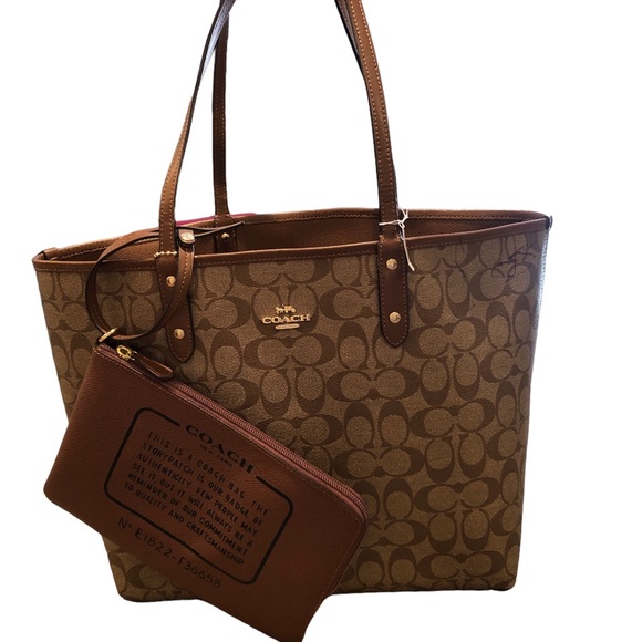 Coach Handbags - Coach Reversible Signature Saddle Tote Bag With Detachable Pouch. ON HOLD